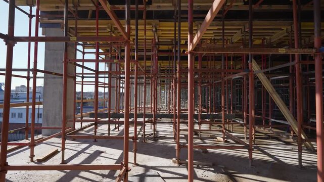 Overview of interior construction scaffolding inside a building