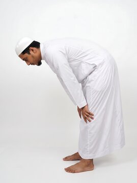 Muslim man performing ruku prayer position