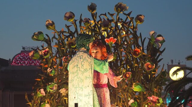 Night parade in Viareggio highlighting elaborate allegorical floats with vibrant costumes and artistic expressions