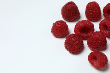 Ripe raspberries on a white background. Top view. Flat lay. © Pixora ST 