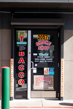 Separate smoke shop with it's own entrance isolated behind a neighborhood quick stop. St Paul Minnesota MN USA