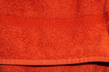 Red Terry Towel Fabric Texture Background with Soft Looped Cotton Surface © ZackZephyr