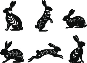 Obraz premium Collection of black rabbit silhouettes with white floral designs