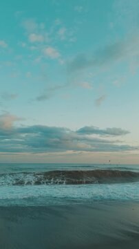 Stormy sea with waves crashing at romantic sunset slow motion