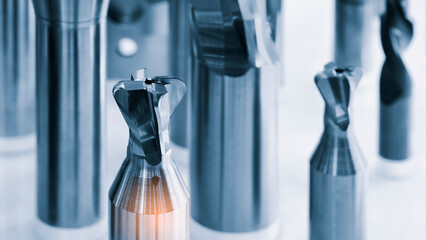 various types drill bits milling cutter. display organized and bits arranged  tech industrial technology background © Aleksandr Matveev