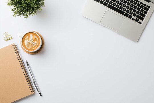 Workspace with minimalist office desk laptop coffee notebook pen and small plant