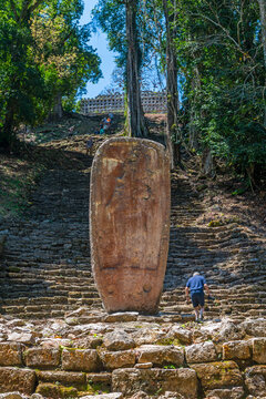 Mayan stela and ruins of Yaxchilan with unrecognizable tourists, Chiapas, Mexico.