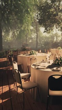 Tables are arranged in a garden space with white tablecloths and floral centerpieces. Sunlight filters through trees, creating an inviting atmosphere for guests.
