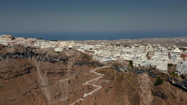 Aerial cliffside view of Fira/Thira, Santorini, Greece with switchback path