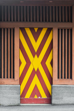 Colorful yellow red striped wooden door architecture
