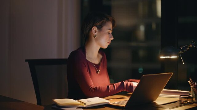 Pensive entrepreneur looking screen late night office. Woman holding coffee cup