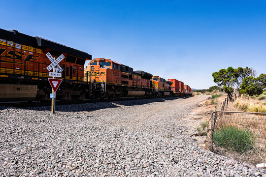 Chilton Ranch crossing 7-12-2026 Mountainair NM USAEast Bound BNSF stack train climbing towards Mountainair New Mexico at the Chilton Ranch crossing on the BNSF Clovis Sub