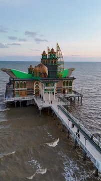 Drone view of the Ziyadatul Abrar Floating Mosque, located at Siring Pagatan Beach, South Kalimantan