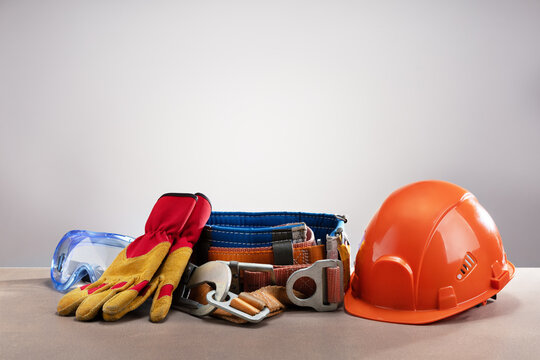 Personal protection equipment on gray background with copy space.