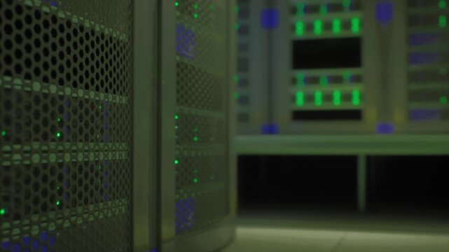 Closeup ai rack with green lights, mesh front panel and visible indicator LEDs, shallow depth of field, GPU accelerators processing inference workloads, urban