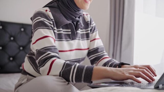 Woman typing on a laptop keyboard key, conveying typing, digital communication and focused office work.