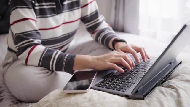 Woman typing on a laptop keyboard key, conveying typing, digital communication and focused office work.