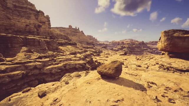 highangle canyon background showing layered terraces rocky outcrops and sweeping gullies under clear sky providing compositional depth ideal for banners