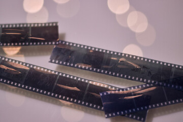 View of photographic rolls showing some of their scenes, with dim lighting © Nano