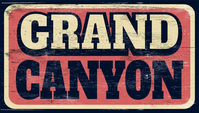 Aged and worn retro Grand Canyon sign on wood