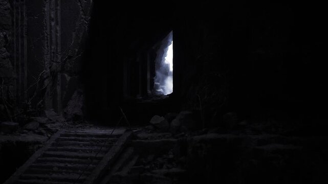 Hidden exit stair veiled in shadow, narrow ramp of rough stone, pale slit of daylight promising fresh air, contemplative mood suited for escape narrative