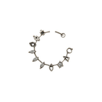 Silver ear cuff with geometric shapes and sparkling stones on black background isolated on white background