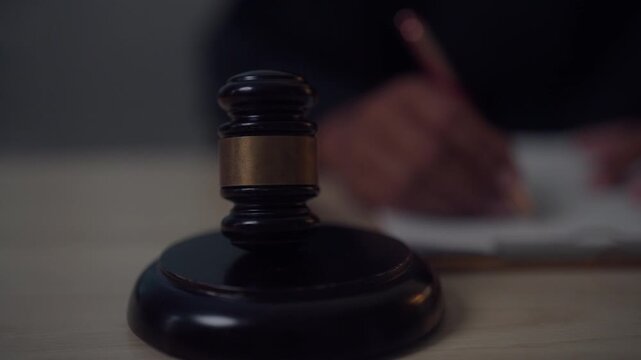 Signing Legal Documents with Judge's Gavel for Business Contract and Legal Agreement