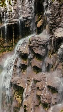 Tolantongo, Mexico Spectacular waterfalls rushing down a rocky cliff covered with moss