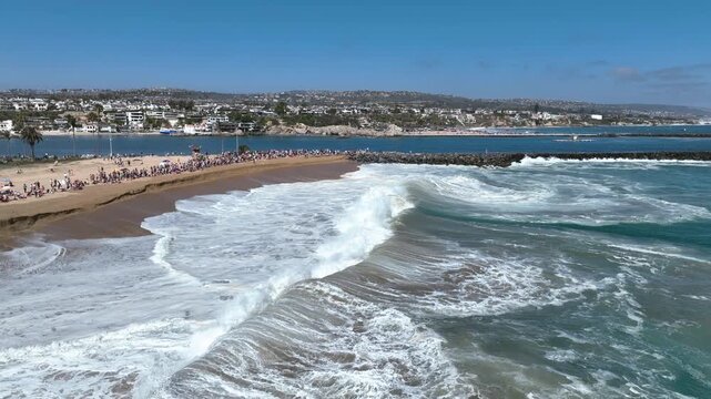 Enourmous waves crushing the coast of the California Wedge drone panorama
