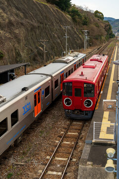 Nagasaki, Japan - March 15 2026: JR Kyushu's red multi-functional track inspection train 'BIG EYE' parked at Okusa Station on the Nagasaki Main Line, Japan.