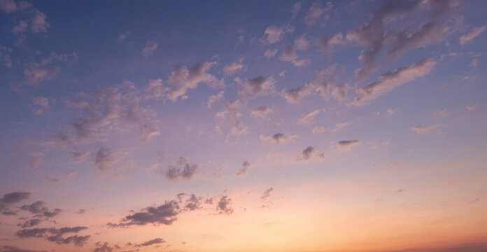 Panoramic view of sunset golden and blue sky nature background.
Colorful dramatic sky with cloud at sunset.Sky background.Sky with clouds at sunset.