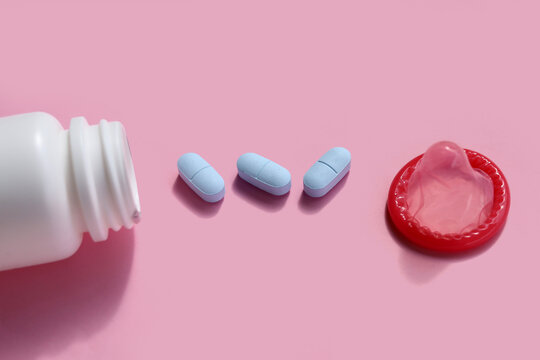 Close-up of HIV prevention concept featuring PrEP medication and a condom
