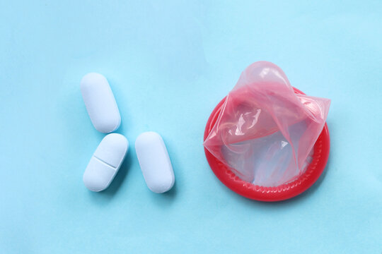 Close-up of HIV prevention concept featuring PrEP medication and a condom