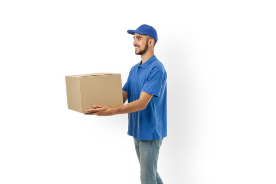 Delivery man holds a cardboard box in a modern setting, isolated, PNG