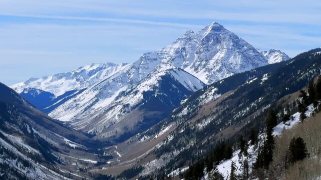 Winter Aspen Buttermilk Mountain Ski Area resort Cliffhouse snow-covered Pyramid Peak 14er Colorado panoramic nature landscape Maroon Creek Valley Elk Mountain Range White River Forest zoom in