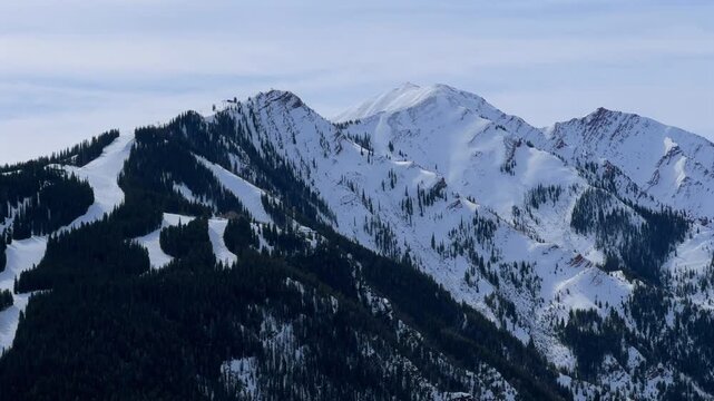 Aspen Highlands Ski Resort winter grey skies morning Highlands Bowl skiing snowboarding destination cat ski runs trails nature landscape Colorado from Buttermilk Mountain Maroon Creek Valley static