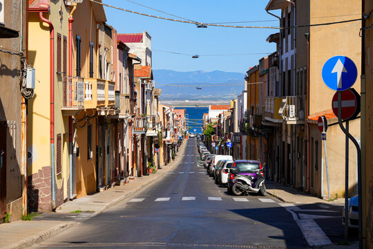 Picturesque street descending towards the sea in Sant'Antioco, Sardinia, Italy