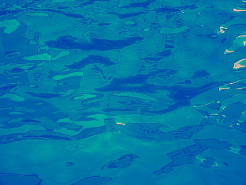 Psychedelic Deep Blue Teal Abstract Water Surface with Green Glow Dot Neon Background