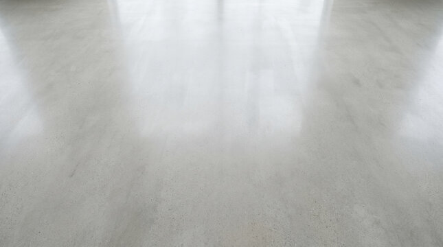 Polished gray concrete floor with glossy reflective surface