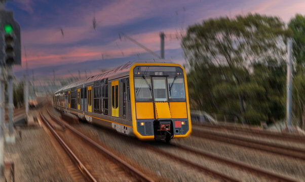 Passenger Train going through Lewisham Train Station at Sunset a suburban Sydney train Station in Sydney NSW Australia