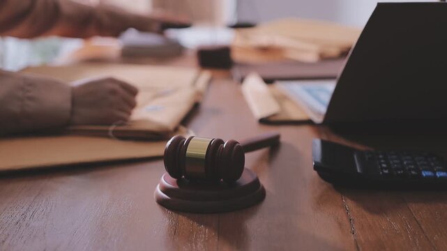 Consultation and conference of professional businesswoman and Male lawyers working and discussion having at law firm in office. Concepts of law, Judge gavel with scales of justice
