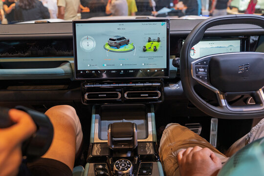 Penang, Malaysia - May 2, 2026: Interior dashboard view of a Jaecoo J6 electric vehicle showing the central touchscreen infotainment monitor and steering wheel at a car show.