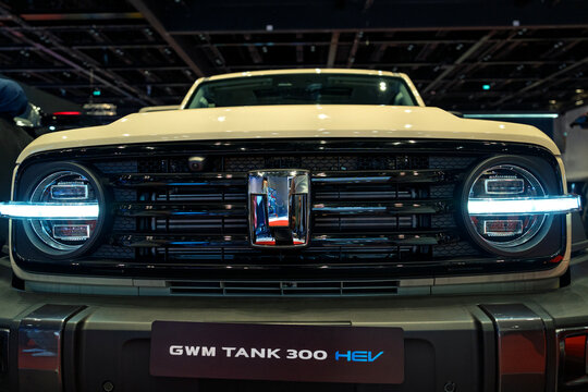 Penang, Malaysia - May 2, 2026: Close-up front view of a GWM Tank 300 HEV off-road SUV showing its circular LED headlights and rugged front grille at a car exhibition.