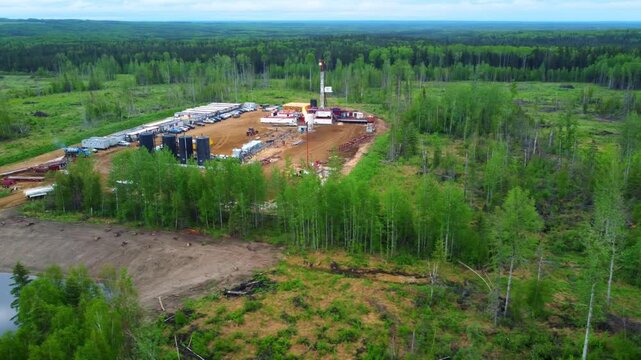 Burning H₂S flare at a remote drilling rig in Alberta during summertime