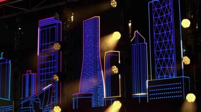 Neon style concert stage backdrop with iconic Calgary buildings, lights