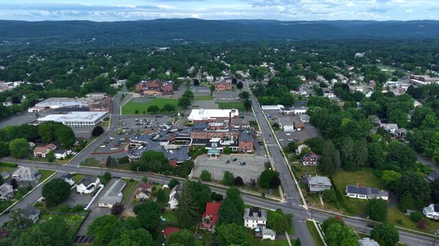 Aerial view of hospital complex and surrounding residential area on a clear summer day