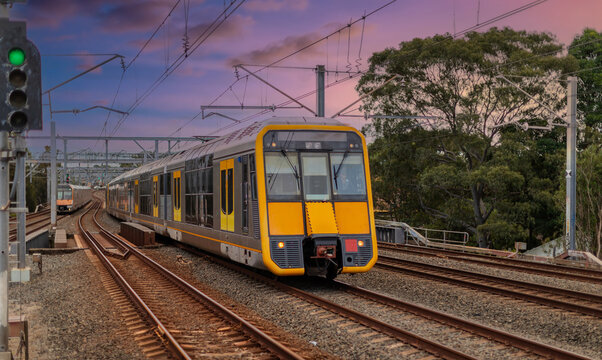 Passenger Train going through Lewisham Train Station at Sunset a suburban Sydney train Station in Sydney NSW Australia