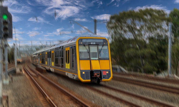 Passenger Train going through Lewisham Train Station at Sunset a suburban Sydney train Station in Sydney NSW Australia