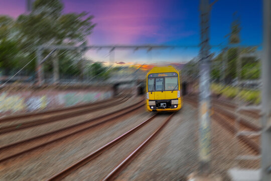 Passenger Train going through Lewisham Train Station at Sunset a suburban Sydney train Station in Sydney NSW Australia