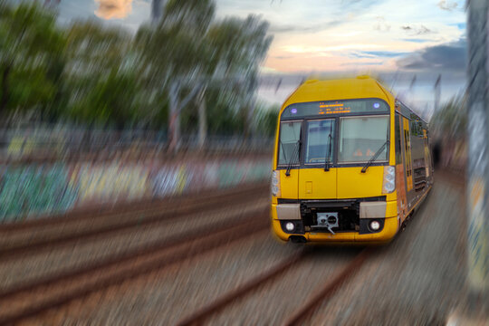 Passenger Train going through Lewisham Train Station at Sunset a suburban Sydney train Station in Sydney NSW Australia